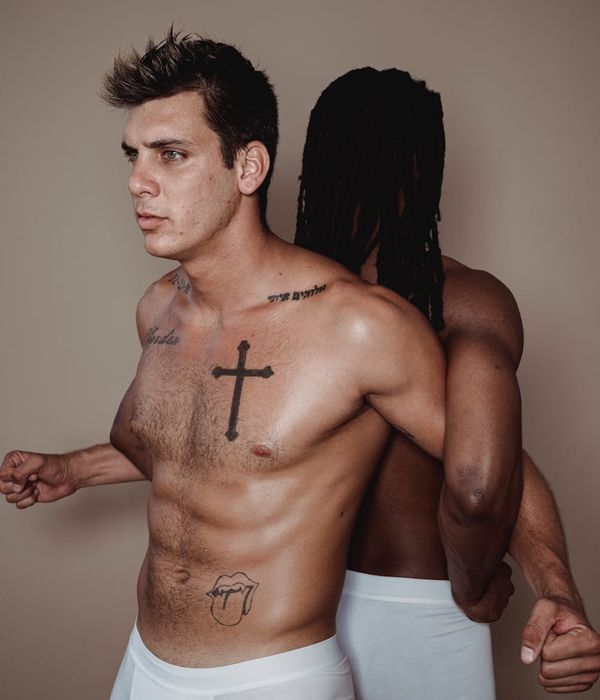 Man performing a controlled strength exercise in a minimalist gym.